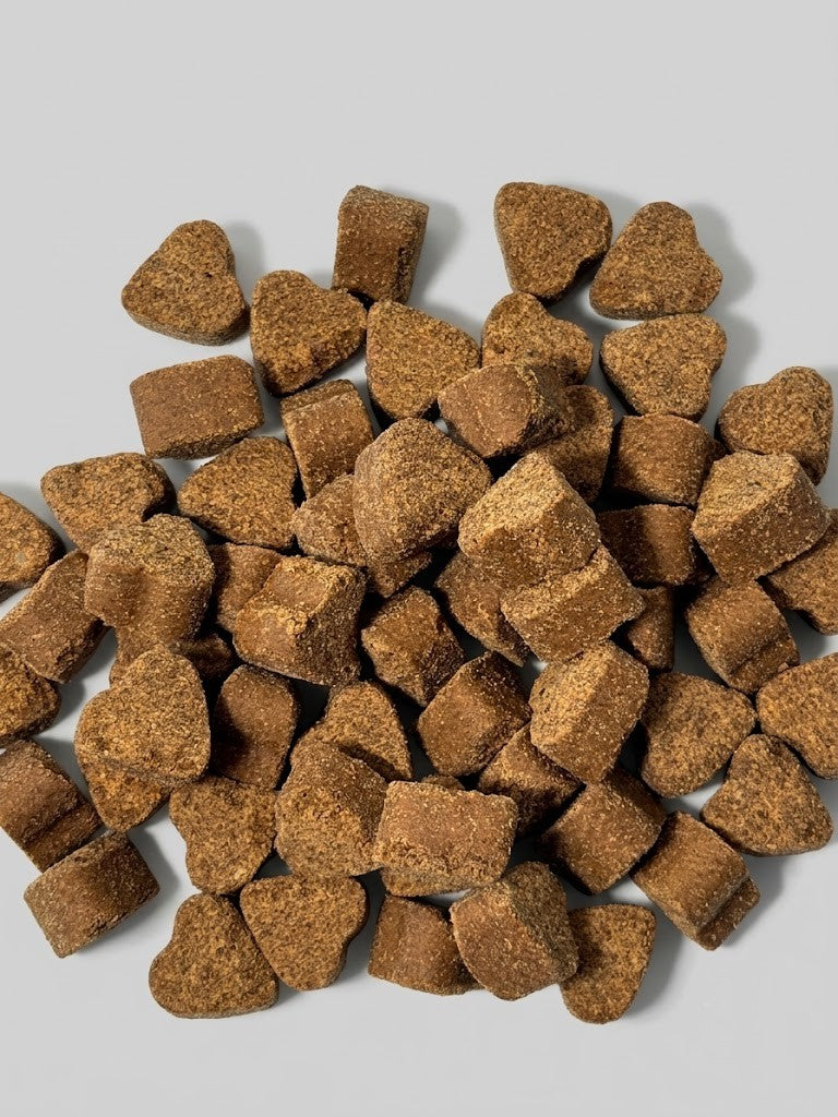 Brown pet treats on a light gray background