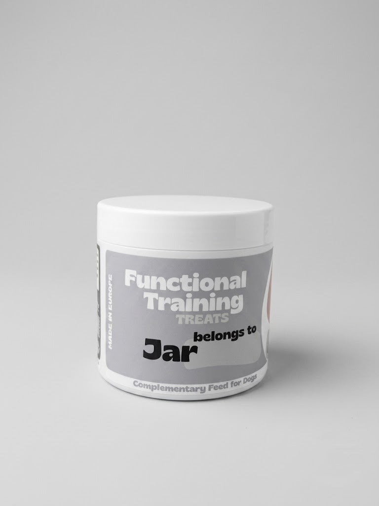 Container of functional training treats for dogs on a gray background